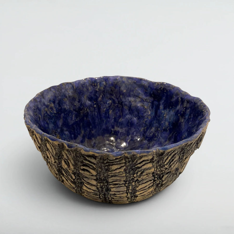 Hand-carved stoneware serving bowl with deep cobalt blue glazed interior